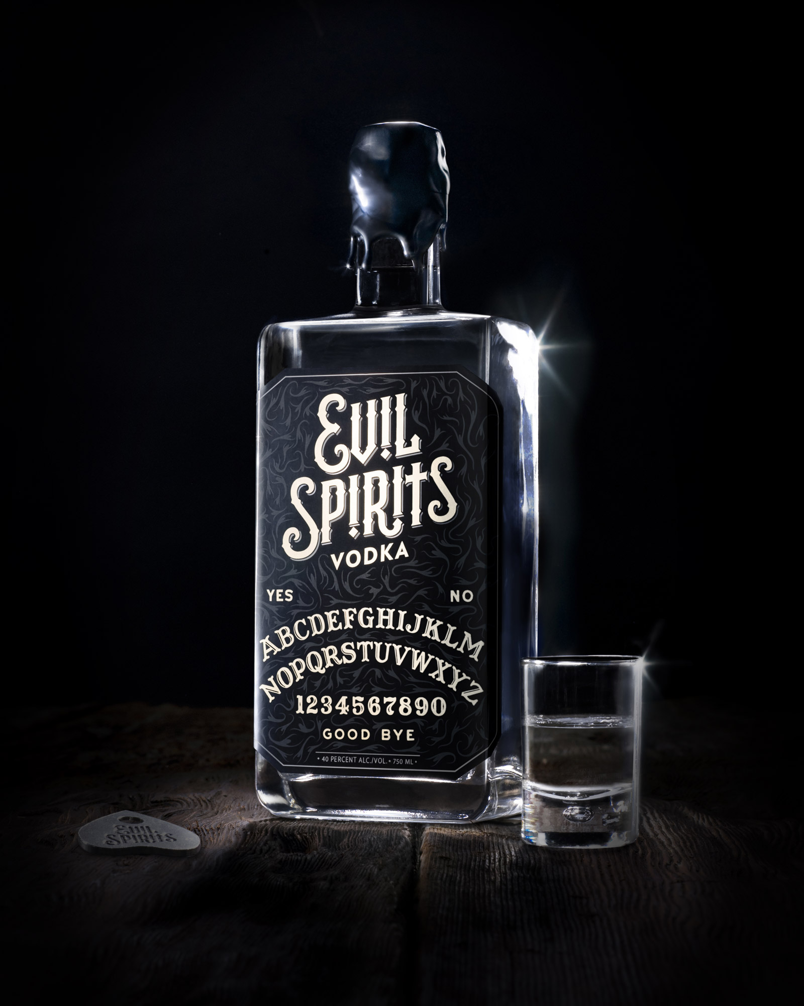 Evil Spirits Vodka Bottle Close-Up with Shot Glass and Planchette